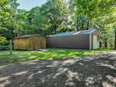 View of yard featuring a storage shed