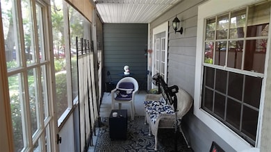 Screened-in front porch is 22 feet long.