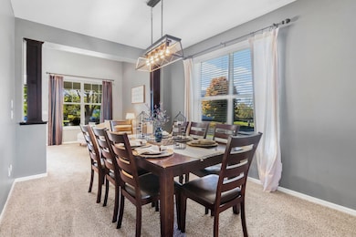 A spacious formal dining room is perfectly scaled for gatherings.