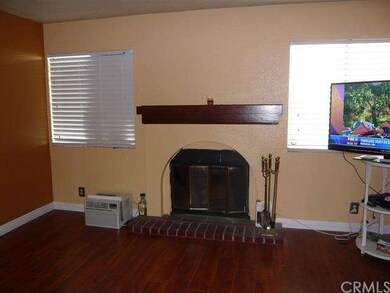 Living room with fireplace and laminate wood floor