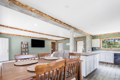 Dining room with sink and dark hardwood / wood-sty