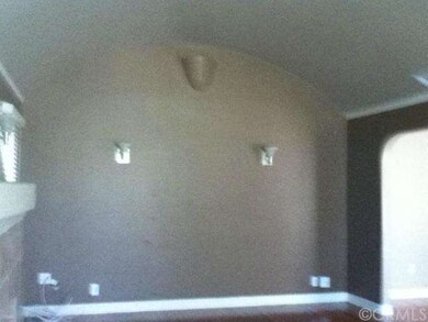 Other end of living room facing the windows, built