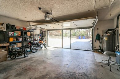 Nice 2 car garage with retractable garage screen