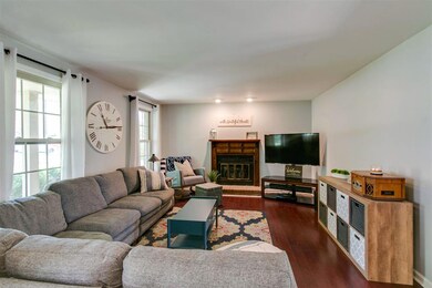 Deep living room area with a natural gas fireplace.