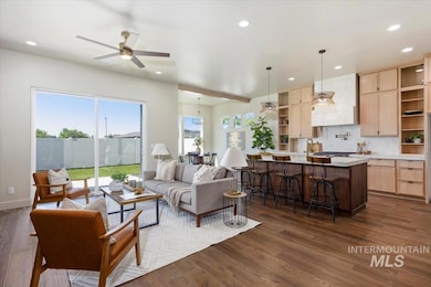 Living area featuring recessed lighting, dark wood-style flooring, and a ceiling fan