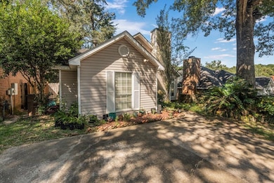 Back of property with a chimney
