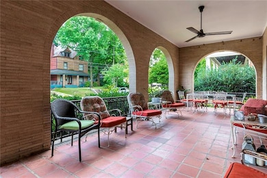 Wide Front Loggia Opens from French Doors in the L