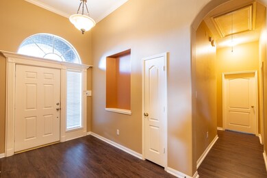 Entrance to home looking into hallway to secondary bedrooms.