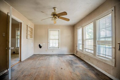 Unfurnished room featuring wood-type flooring and ceiling fan