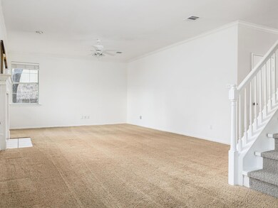 Empty room with a ceiling fan, carpet flooring, o