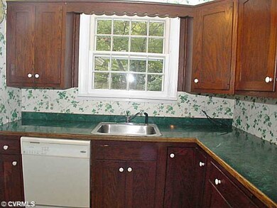 Kitchen - Oak cabinets & window with view of beaut