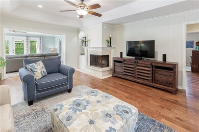 Family room with wood-burning fireplace. 