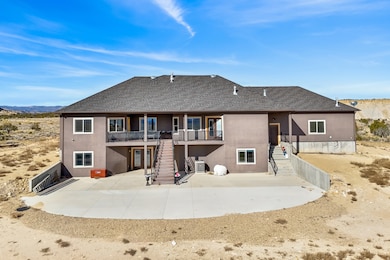 Back of property with roof with shingles, stairs, a patio area, and stucco siding