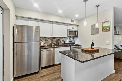 Kitchen with stainless steel appliances, electric