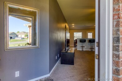 Welcoming foyer opens to large living area on the