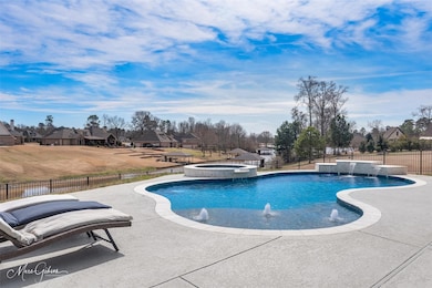 Poo, hot tub and has an outdoor living area.