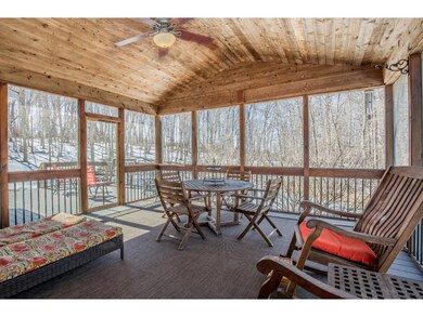 Screen porch features vaulted ceiling with fan, se