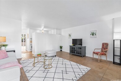 The living room leads into both bedrooms beyond th
