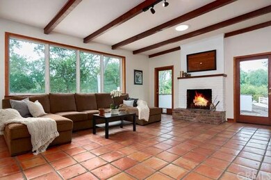 Spacious family room with wood beamed ceilings