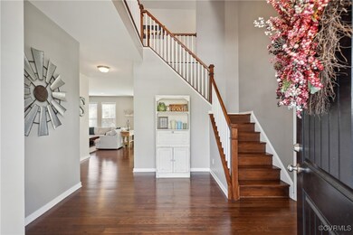 Entryway with dark hardwood / wood-style floors
