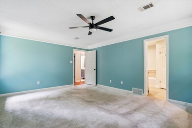 Spare room featuring carpet flooring, ornamental m