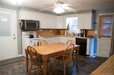 Large eat in kitchen with brand new floors and fre