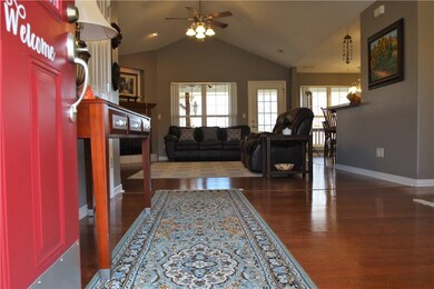 Beaming wood floors.  Open and filled with natural light.  Cathedral ceiling