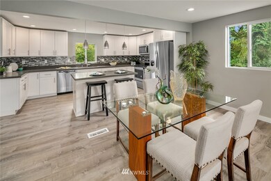 Spacious, open floor design with gorgeous hardwood floors and gorgeous, brand new kitchen