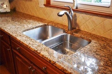 It is adorned with granite countertops and beautif