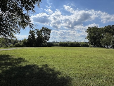 View of green lawn featuring a view of countryside