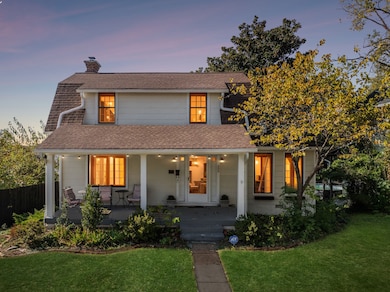 The front of the house features large, inviting windows that provide perfectly filtered daylight to brighten the home.