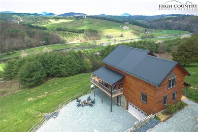 Overhead drone photo of property w/view of the New