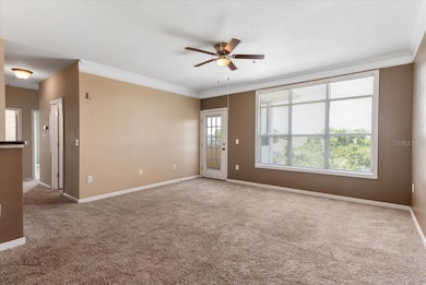 View from the front door; door on the right leads to the screened in porch and the hallway on the left leads to the 2 bedrooms and bath.