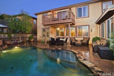 Pool and back of home at twilight