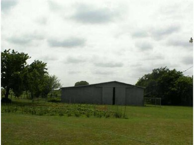 Other. View of large barn with stalls and welding 