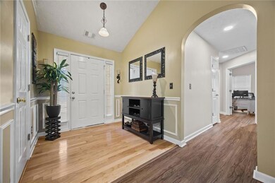 Foyer entrance featuring arched walkways, visible 