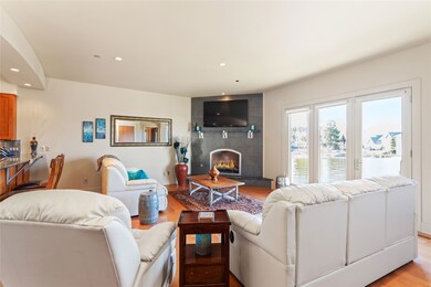 Open living room with canal view and cozy fireplace