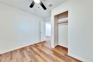 Unfurnished bedroom featuring light wood-style fl