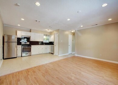 Kitchen with tasteful backsplash, visible vents, 