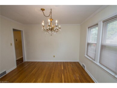 Down dining room with hardwood floors