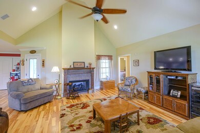cathedral ceiling , fireplace with gas logs and hickory hardwood floor