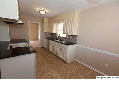 Kitchen features Granite Countertops, Tile Backspl