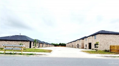 View of asphalt road with curbs and sidewalks
