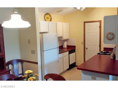 The kitchen is efficient with a large pantry and l