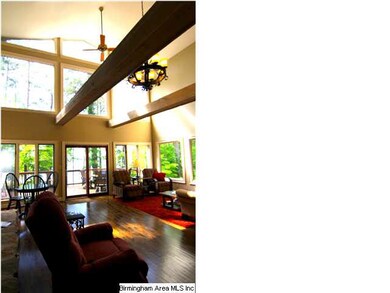 Quaint balcony overlooking front parking area from