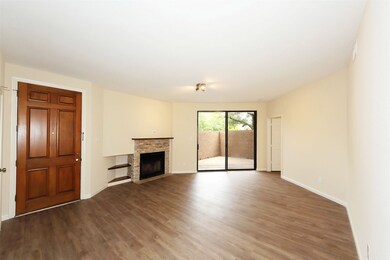 Spacious living room with recent floors, lighting