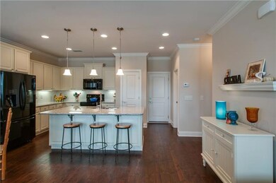 The main level features beautiful hardwoods, crown molding, and a wonderfully finished kitchen!