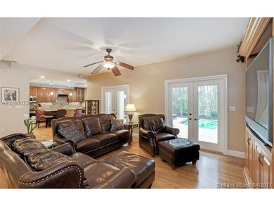 Family room with built-ins open to the gourmet kit