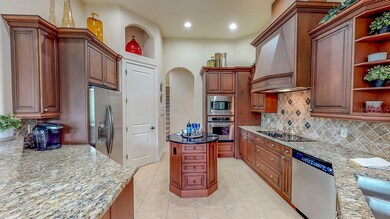 Kitchen with island and closet pantry.