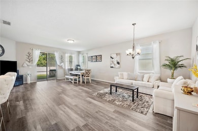 Great Room with sliders leading out to screened porch